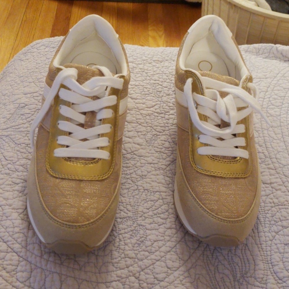 Gold Calvin Klein sneakers